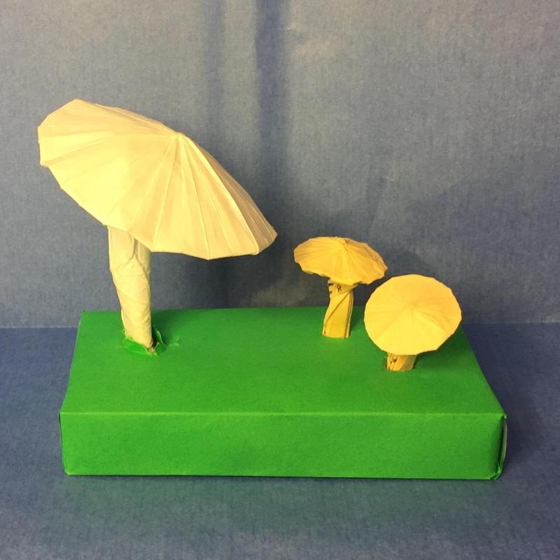 The big mushroom is folded from printer paper, and the small ones are from the bottom pad of a pack of post-its.